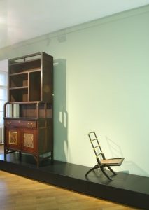 A cupboard and folding chair by Edward William Godwin, as seen at From Arts and Crafts to the Bauhaus. Art and Design - A New Unity, The Bröhan Museum Berlin