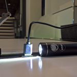 A rechargable USM bike light rechargig in a Haller E USB charger, as seen at USM Haller HomeWork, smow Köln